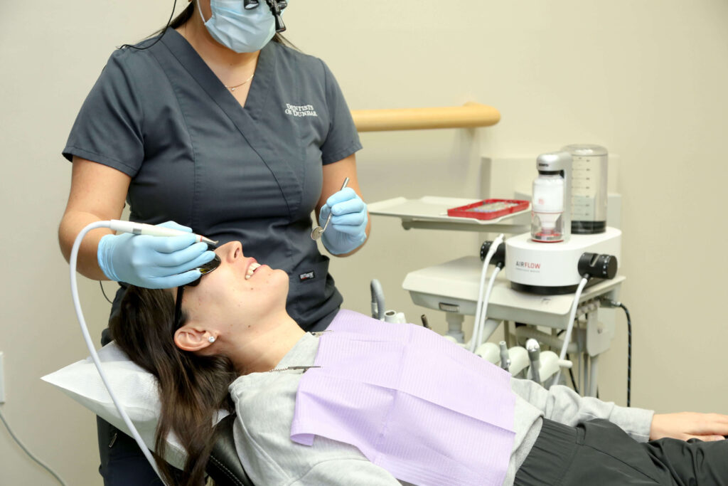 Dental hygienist performing professional teeth cleaning at Dentists on Dunbar in Vancouver